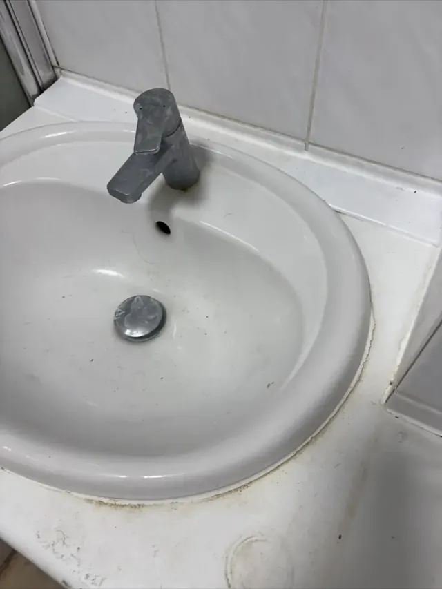Bathroom sink before professional cleaning